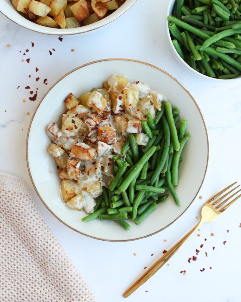 Knusprige Kartoffelwürfel aus dem Ofen mit Sahne und Parmesan